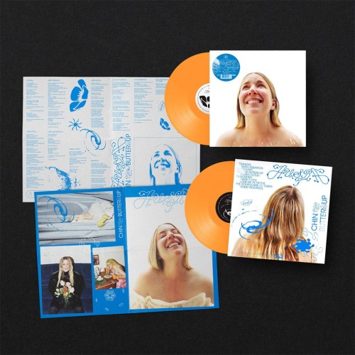 Austra_-_Chin_Up_Buttercup_-_LP_Neon_Orange_Vinyl_with_Double-sided_A2_Poster_-_2025_-_front_and_back.jpg